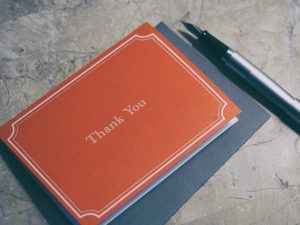 A red thank you note