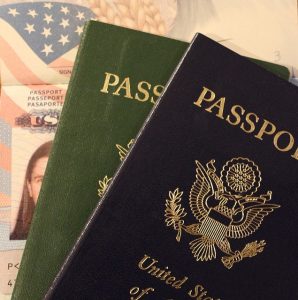 Two passports that will help you register your out of state car in Texas.
