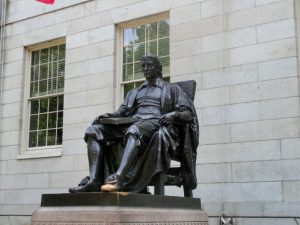 The statue of John Harvard in Boston, one of the best states for international students.