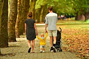 Family walking in a park.