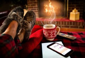 Cosy slippers, fireplace, coffee mug, phone