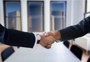Shaking hands with movers before moving from Florida to Texas
