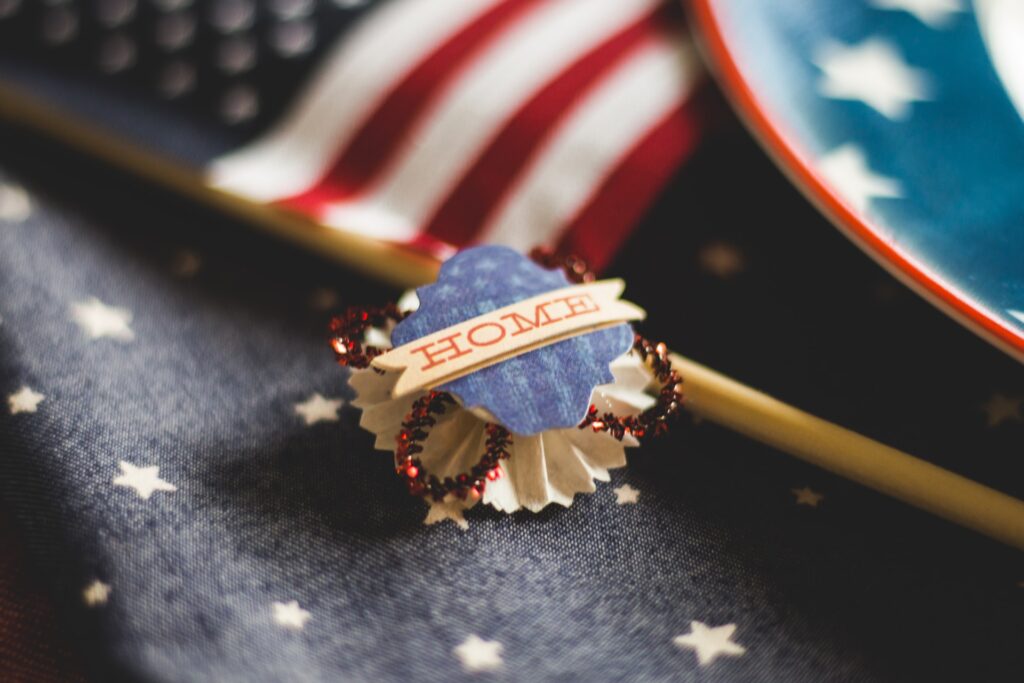 American flag and an ornament with the word 'home' on it