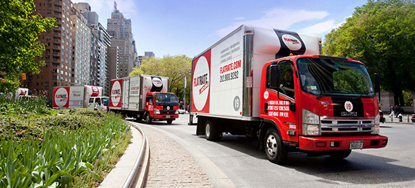 flatrate moving company's trucks on the road