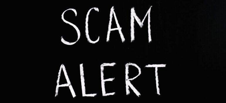 scam alert on a black backgrpund