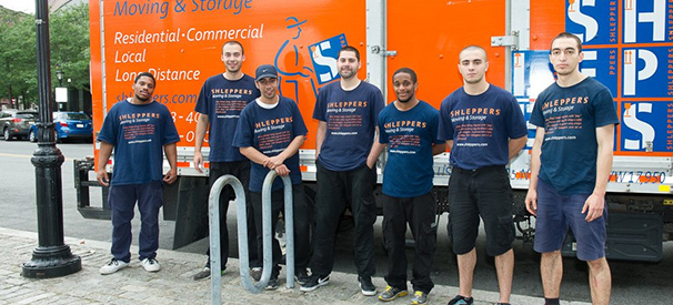shleppers moving & storage company crew in front of their truck