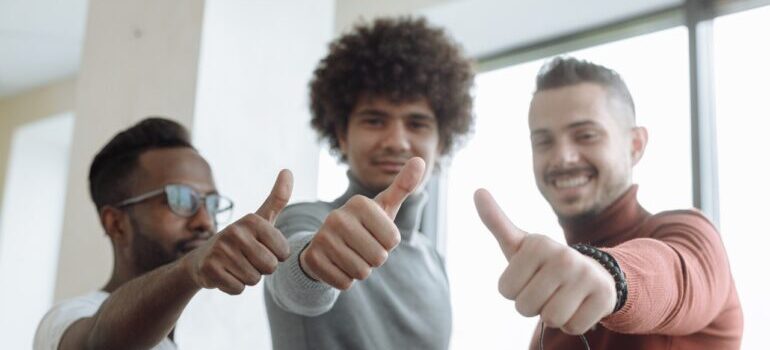 three man giving thumbs up for Midway Moving & Storage