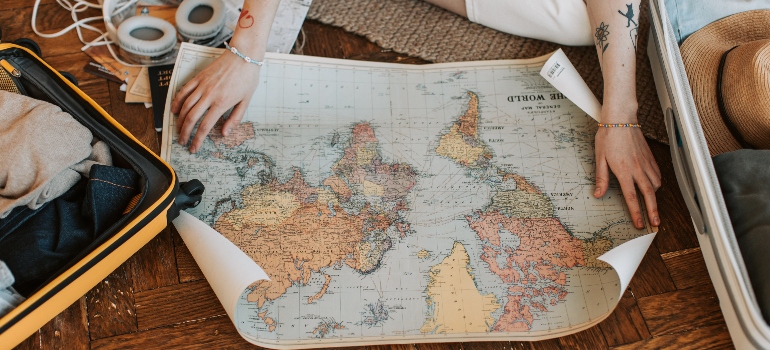 a person holding a map before moving with cross country moving companies Washington offers